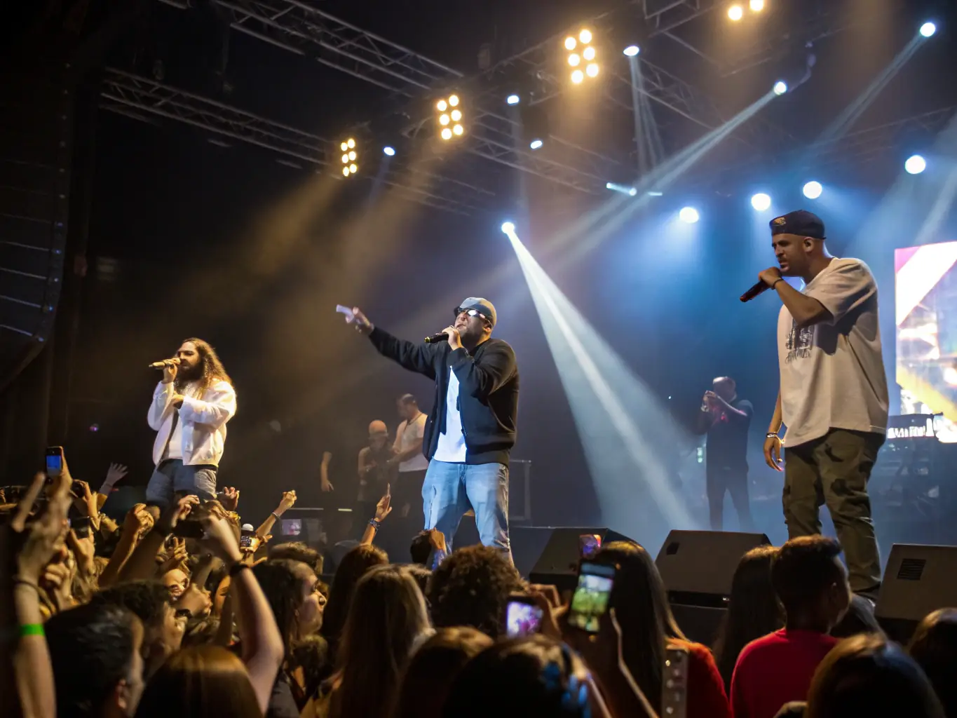 A lively concert scene with musicians performing on stage, colorful lighting, and an enthusiastic audience enjoying the music.